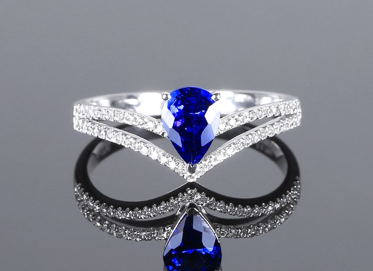 14k Gold 0.92 Ctw Natural Sapphire & Diamond Ring: Ref:231111107 // gold content:14k gold // ring size:7. 25us // // main gemstone:sapphire // shape:pear // carat weight:0. 76ct // color:blue // treatment:natural // // adjacent gemstone 2 :