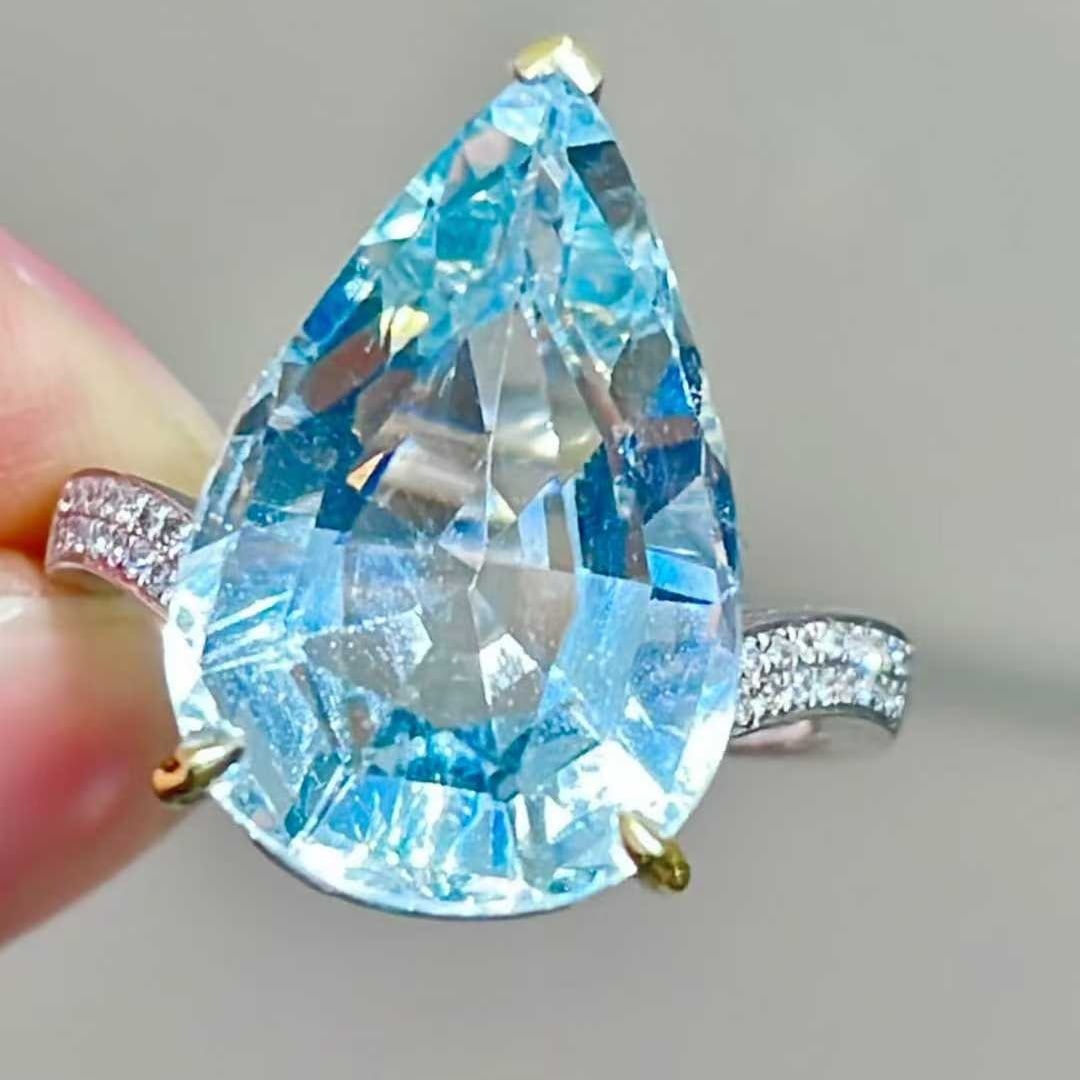 14k Gold 8.85 Ct Natural Aquamarine & Diamond Ring: Ref:231111175 // gold content:14k gold // ring size:7. 25us // // main gemstone:aquamarine // shape:pear // carat weight:8. 85ct // color:blue // treatment:natural // // adjacent gemstone 2 :