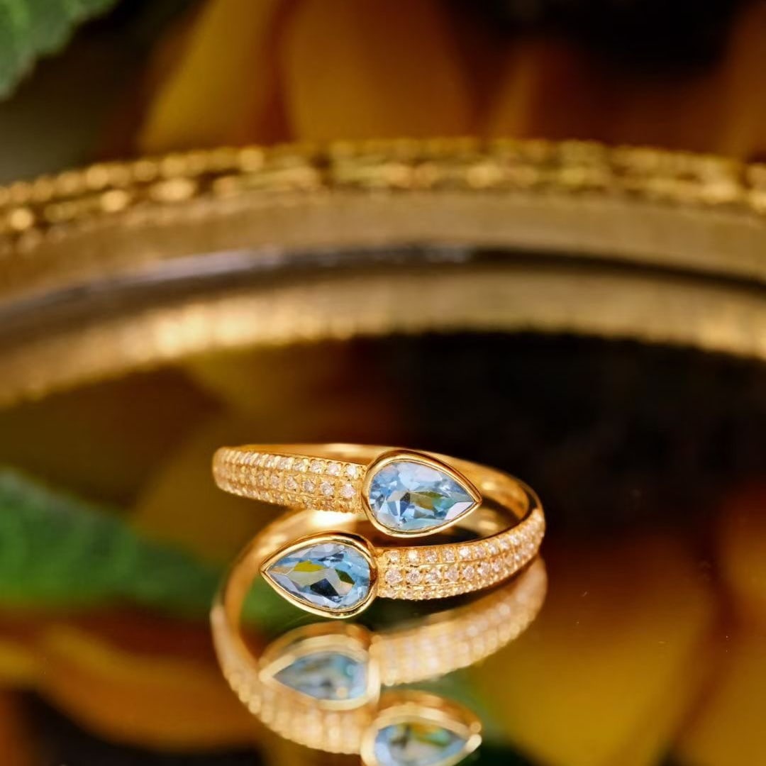 14k Gold 1.04 Ctw Natural Aquamarine & Diamond Ring: Ref:231111210 // gold content:14k gold // ring size:7. 25us // // main gemstone:aquamarine // shape:pear // carat weight:0. 8ct // color:blue // treatment:natural // // adjacent gemstone 2 :