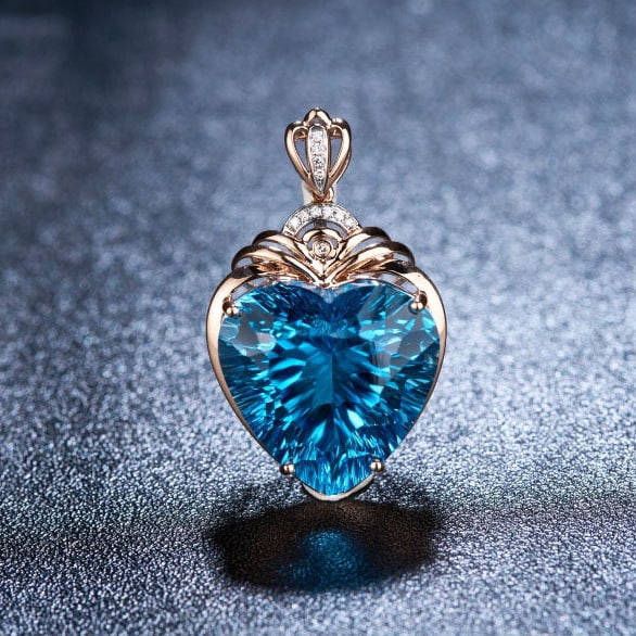 14k Gold 20.68 Ct Natural Topaz & Diamond Pendant( Without Chain ): Ref:231111259 // gold content:14k gold // main gemstone:topaz // shape:heart // carat weight:20. 68ct // color:blue // treatment:natural // // adjacent gemstone 2 : diamond // shape:round // clarity g
