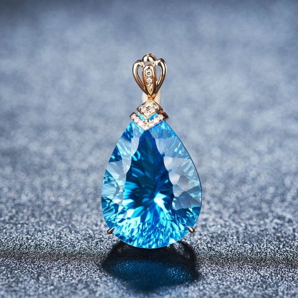 14k Gold 20.2 Ct Natural Topaz & Diamond Pendant( Without Chain ): Ref:231112050 // gold content:14k gold // main gemstone:topaz // shape:pear // carat weight:20. 2ct // color:blue // treatment:natural // // adjacent gemstone 2 : diamond // shape:round // clarity
