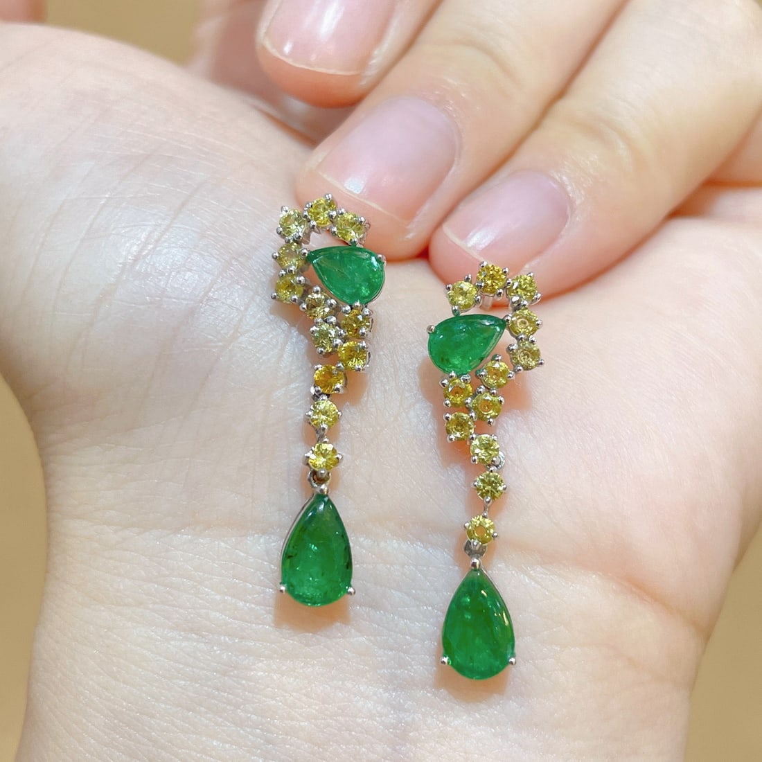 14k Gold 3.29 Ctw Natural Emerald & Sapphire Earrings: Ref:231112408 // gold content:14k gold // main gemstone:emerald // shape:pear // carat weight:1. 99ct // color:green // treatment:natural // // adjacent gemstone 2 : sapphire // shape:round //