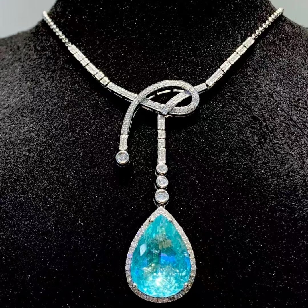 14k Gold 8.54 Ct Natural Paraiba Tourmaline & Diamond Necklace: Ref:231085011 // gold content:14k gold // main gemstone:paraiba tourmaline // shape:pear // carat weight:8. 54ct // color:blue // treatment:natural // // adjacent gemstone 2 : diamond //