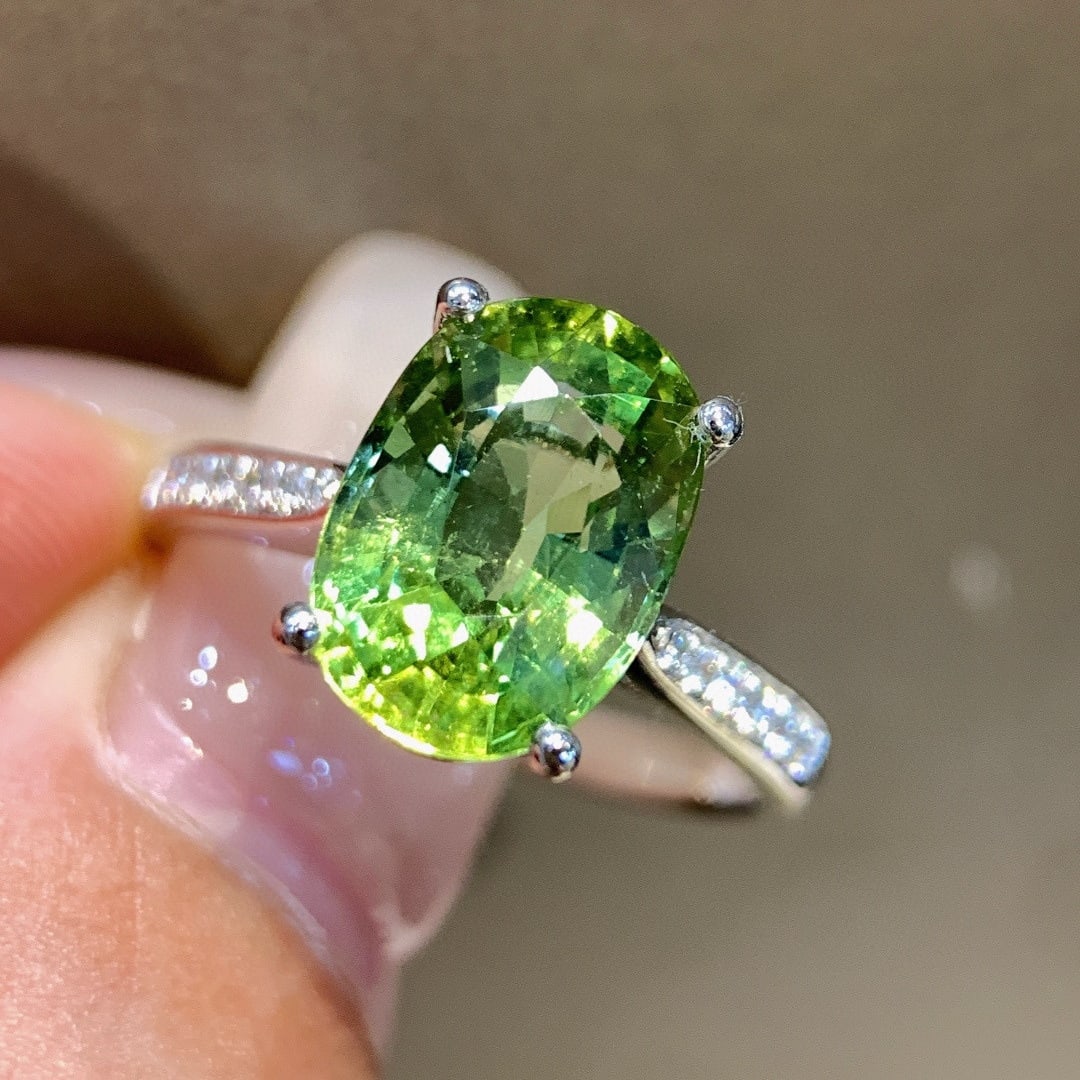 14k Gold 3.57 Ctw Natural Tourmaline & Diamond Ring: Ref:231085087 // gold content:14k gold // ring size:7. 25us // // main gemstone:tourmaline // shape:oval // carat weight:3. 47ct // color:green // treatment:natural // // adjacent gemstone 2 :