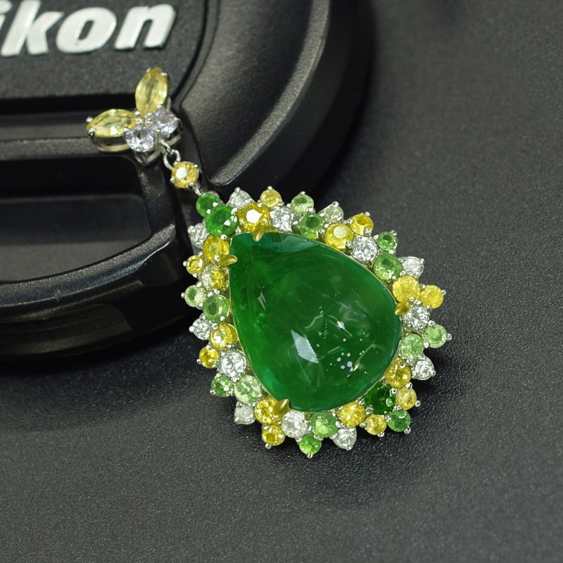 14k Gold 9.87 Ctw Natural Emerald & Sapphire Pendant( Without Chain ): Ref:231085140 // gold content:14k gold // main gemstone:emerald // shape:pear // carat weight:8. 58ct // color:green // treatment:natural // // adjacent gemstone 2 : sapphire // shape:multiple //