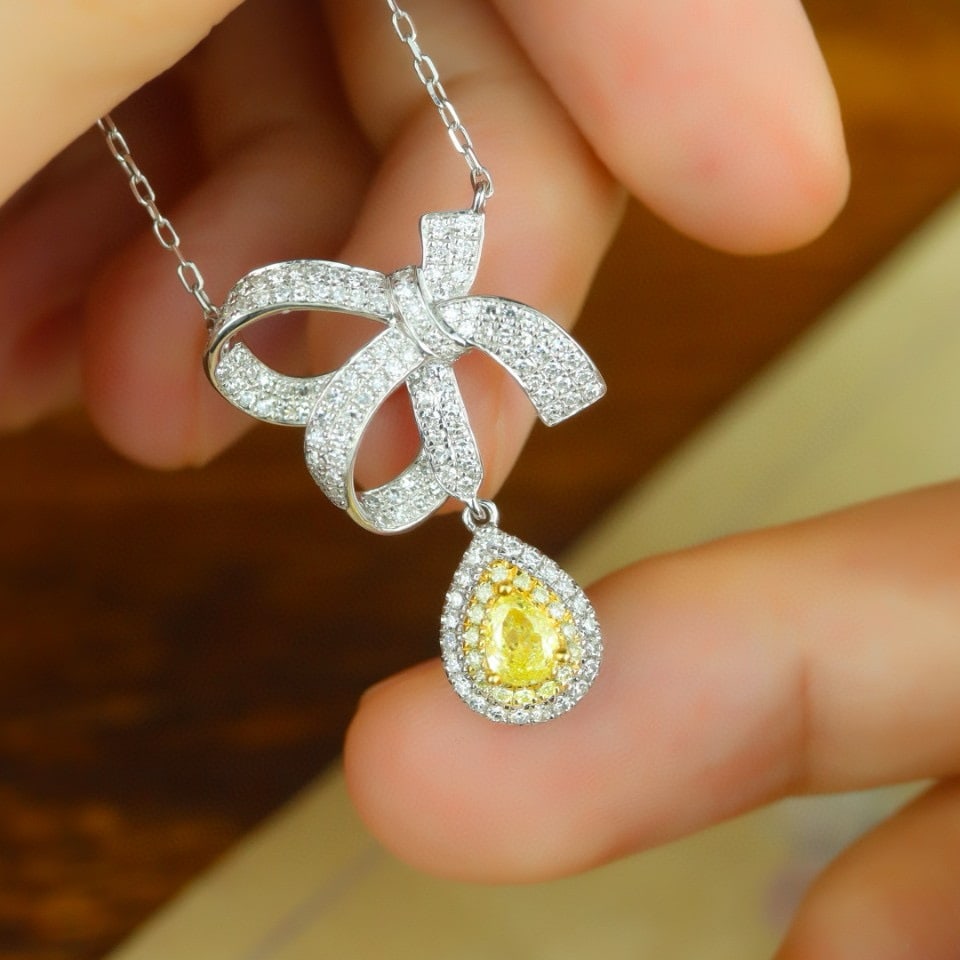 14k Gold 0.69 Ctw Natural Yellow Diamond & Diamond Necklace: Ref:231085159 // gold content:14k gold // main gemstone:yellow diamond // shape:pear // carat weight:0. 21ct // color:yellow // treatment:natural // // adjacent gemstone 2 : diamond // shape:round