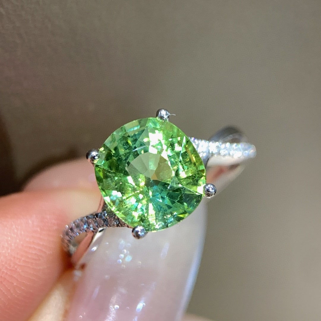 14k Gold 3.09 Ctw Natural Tourmaline & Diamond Ring: Ref:231085215 // gold content:14k gold // ring size:7. 25us // // main gemstone:tourmaline // shape:oval // carat weight:2. 98ct // color:green // treatment:natural // // adjacent gemstone 2 :