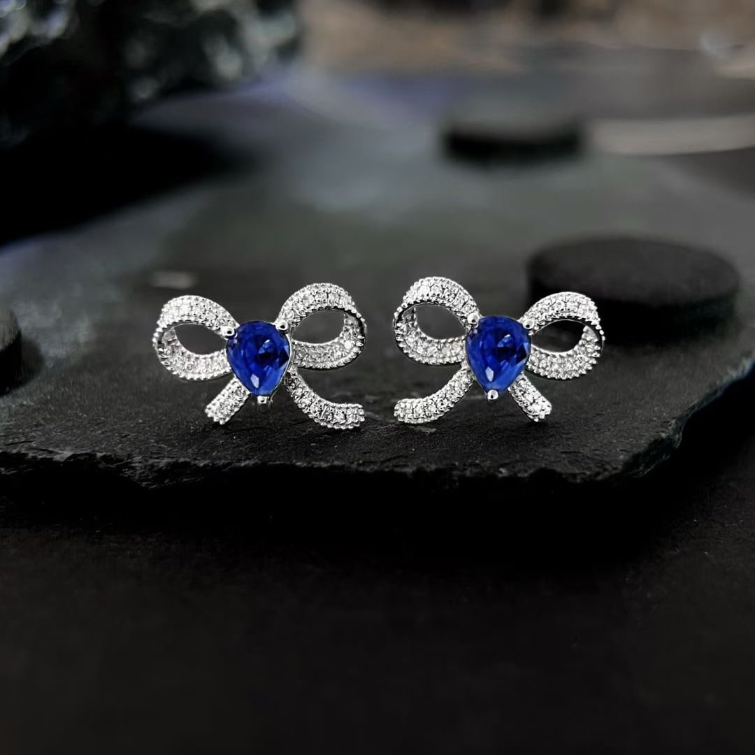14k Gold 0.92 Ctw Natural Sapphire & Diamond Earrings: Ref:231085251 // gold content:14k gold // main gemstone:sapphire // shape:pear // carat weight:0. 8ct // color:blue // treatment:natural // // adjacent gemstone 2 : diamond // shape:round // carat