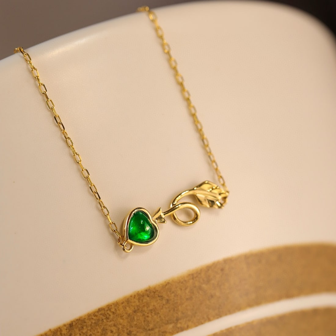 14k Gold 0.21 Ct Vivid Green Natural Emerald Necklace: Ref:231086123 // gold content:14k gold // main gemstone:emerald // shape:heart // carat weight:0. 21ct // color:vivid green // treatment:natural // Condition: New Low Estimate: 1800.00 High Estimate:
