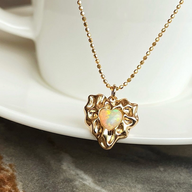 14k Gold 0.2 Ct Natural Opal Pendant( Without Chain ): Ref:231086210 // gold content:14k gold // main gemstone:opal // shape:heart // carat weight:0. 2ct // color:color // treatment:natural // Condition: NewLow Estimate: 1700.00High Estimate: 2500.00