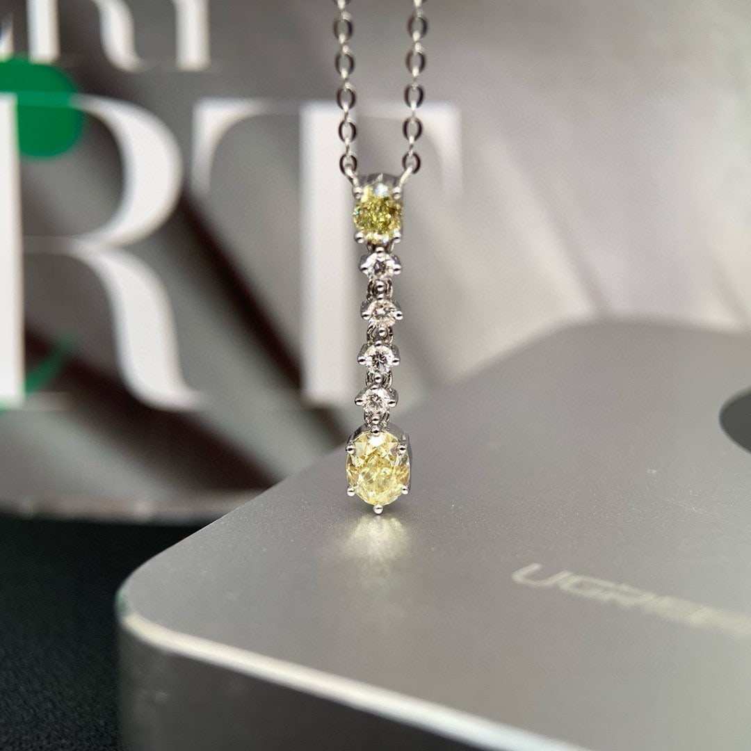 14k Gold 0.60 Ctw Natural Yellow Diamond & Diamond Necklace: Ref:231086219 // gold content:14k gold // main gemstone:yellow diamond // shape:oval // carat weight:0. 48ct // color:yellow // treatment:natural // // adjacent gemstone 2 : diamond // shape:round