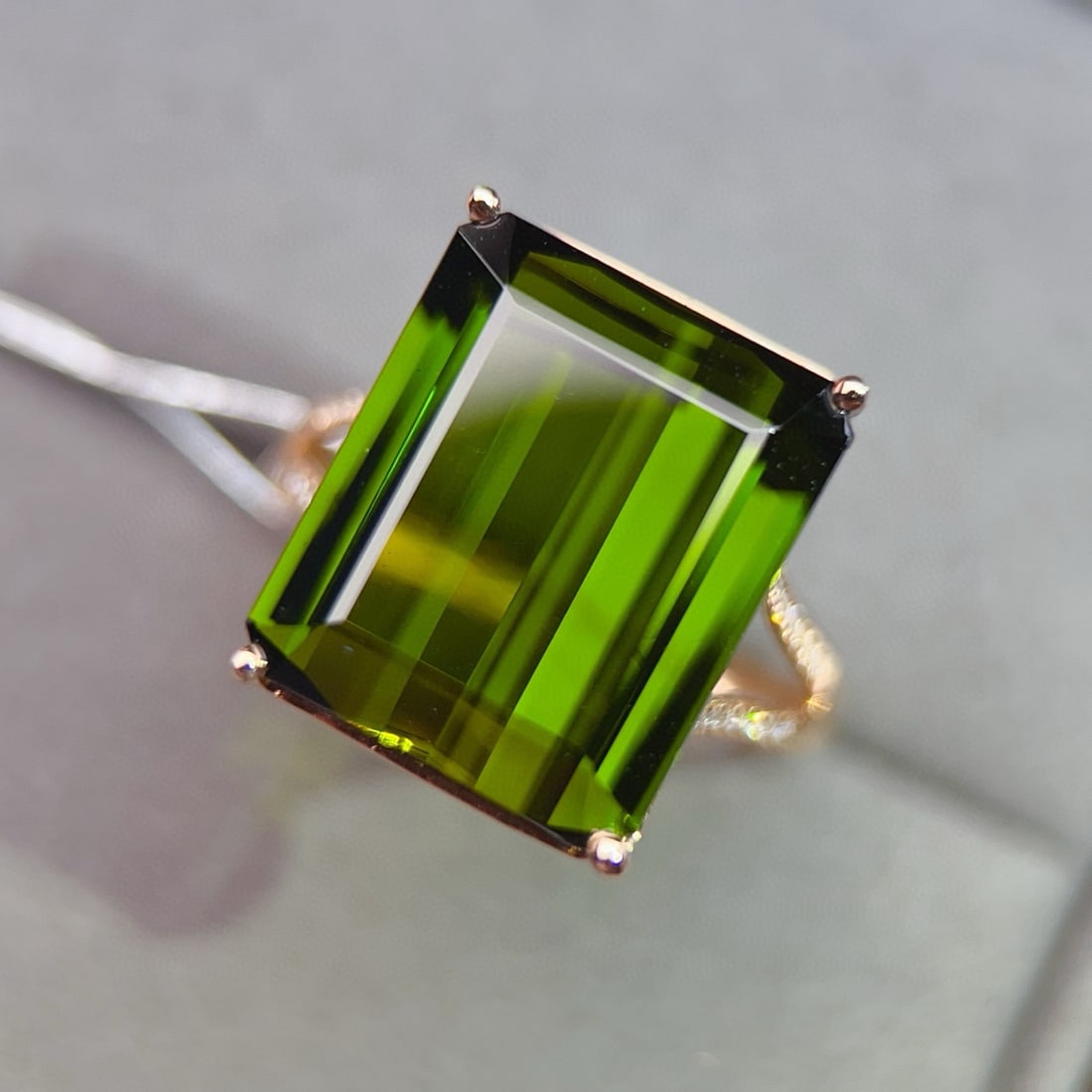 14k Gold 10.84 Ctw Natural Tourmaline & Diamond Ring: Ref:231087204 // gold content:14k gold // ring size:7. 25 us // // main gemstone:tourmaline // shape:octagonal // carat weight:10. 75ct // color:green // treatment:natural // // adjacent gemstone