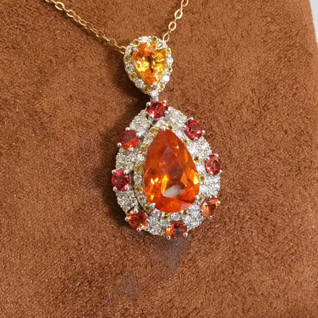 14k Gold 6.43 Ctw Natural Spessartine & Diamond Pendant( Without Chain ): Ref:231087253 // gold content:14k gold // main gemstone:spessartine // shape:pear // carat weight:5. 8ct // color:orange // treatment:natural // // adjacent gemstone 2 : diamond // shape:round //