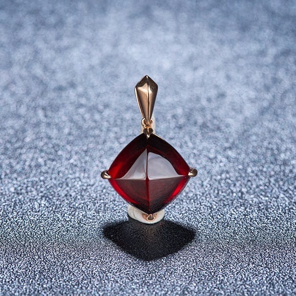 14k Gold 8.35 Ct Natural Garnet Pendant( Without Chain ): Ref:231088007 // gold content:14k gold // main gemstone:garnet // shape:sugar-loaf // carat weight:8. 35ct // color:red // treatment:natural // Condition: New High Estimate: 2500 Low Estimate: 1700