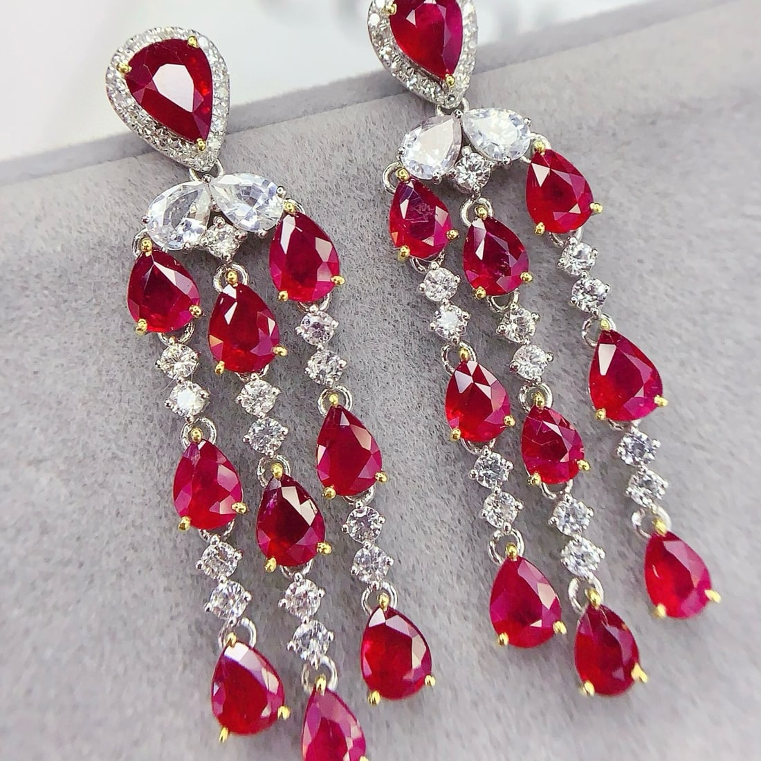 14k Gold 6.93 Ct Vivid Red Natural Ruby & Diamond & Sapphire Earrings: Ref:231088051 // gold content:14k gold // main gemstone:ruby // shape:pear // carat weight:6. 93ct // color:vivid red // treatment:natural // // adjacent gemstone 2 : diamond // number of stones:36 //
