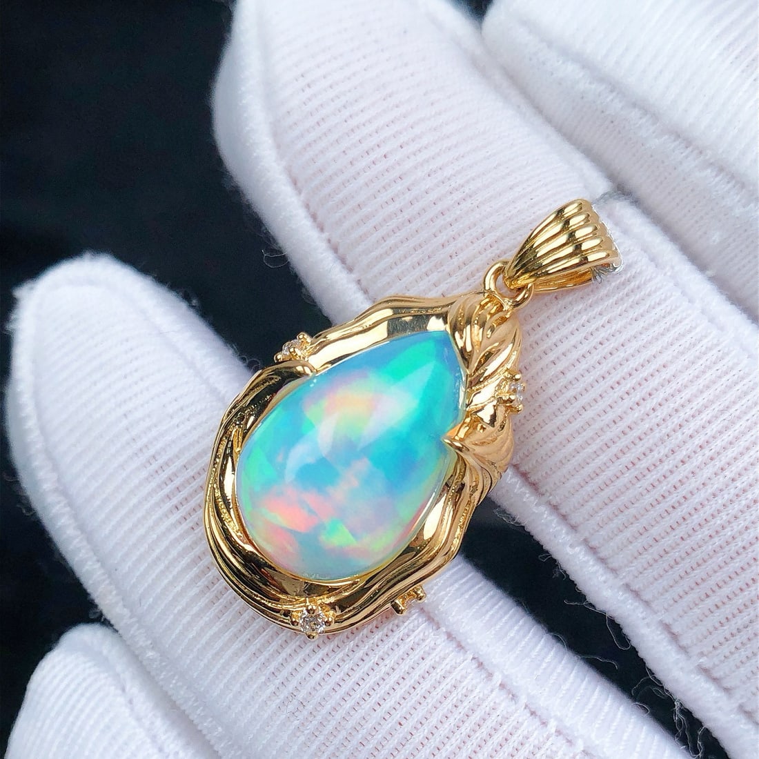 14k Gold 4.85 Ctw Natural Opal & Diamond Pendant( Without Chain ): Ref:231088300 // gold content:14k gold // main gemstone:opal // shape:pear // carat weight:4. 79ct // color:color // treatment:natural // // adjacent gemstone 2 : diamond // shape:round // carat