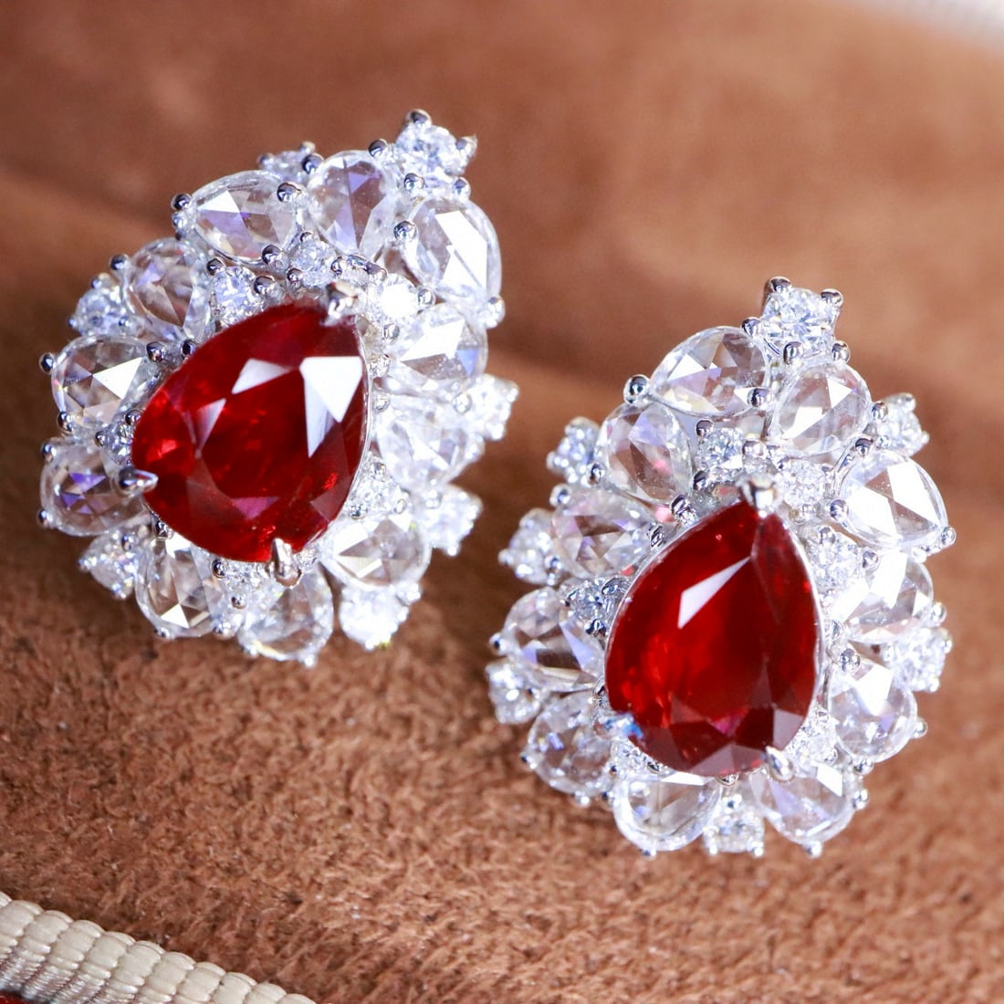 14k Gold 3.09 Ctw Natural Ruby & Diamond Earrings: Ref:231088318 // gold content:14k gold // main gemstone:ruby // shape:pear // carat weight:2. 04ct // color:red // treatment:natural // // adjacent gemstone 2 : diamond // shape:multiple // carat