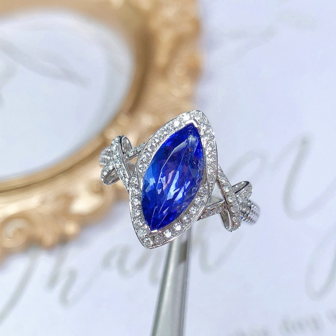 14k Gold 2.12 Ctw Natural Tanzanite & Diamond Ring: Ref:231088387 // gold content:14k gold // ring size:7. 25us // // main gemstone:tanzanite // shape:marquise // carat weight:1. 86ct // color:blue // treatment:natural // // adjacent gemstone 2 :