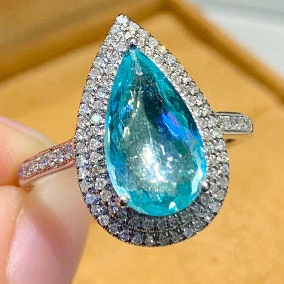 14k Gold 2.25 Ct Natural Paraiba Tourmaline & Diamond Ring: Ref:231088403 // gold content:14k gold // ring size:7. 25us // // main gemstone:paraiba tourmaline // shape:pear // carat weight:2. 25ct // color:blue // treatment:natural // // adjacent gemstone 2 :