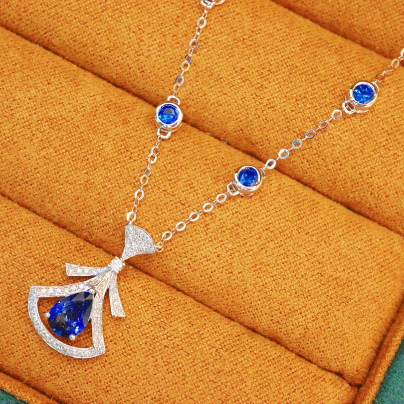 14k Gold 1.08 Ctw Natural Sapphire & Diamond Necklace: Ref:231088414 // gold content:14k gold // main gemstone:sapphire // shape:pear // carat weight:0. 9ct // color:blue // treatment:natural // // adjacent gemstone 2 : diamond // number of stones:54