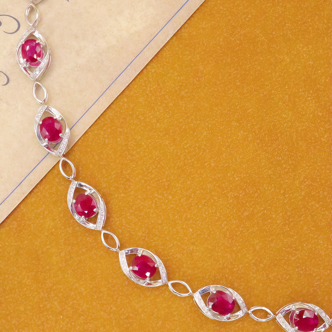 14k Gold 3.71 Ctw Natural Ruby & Diamond Bracelet: Ref:231090046 // gold content:14k gold // main gemstone:ruby // shape:oval // carat weight:3. 50ct // color:red // treatment:natural // // adjacent gemstone 2 : diamond // number of stones:70 //