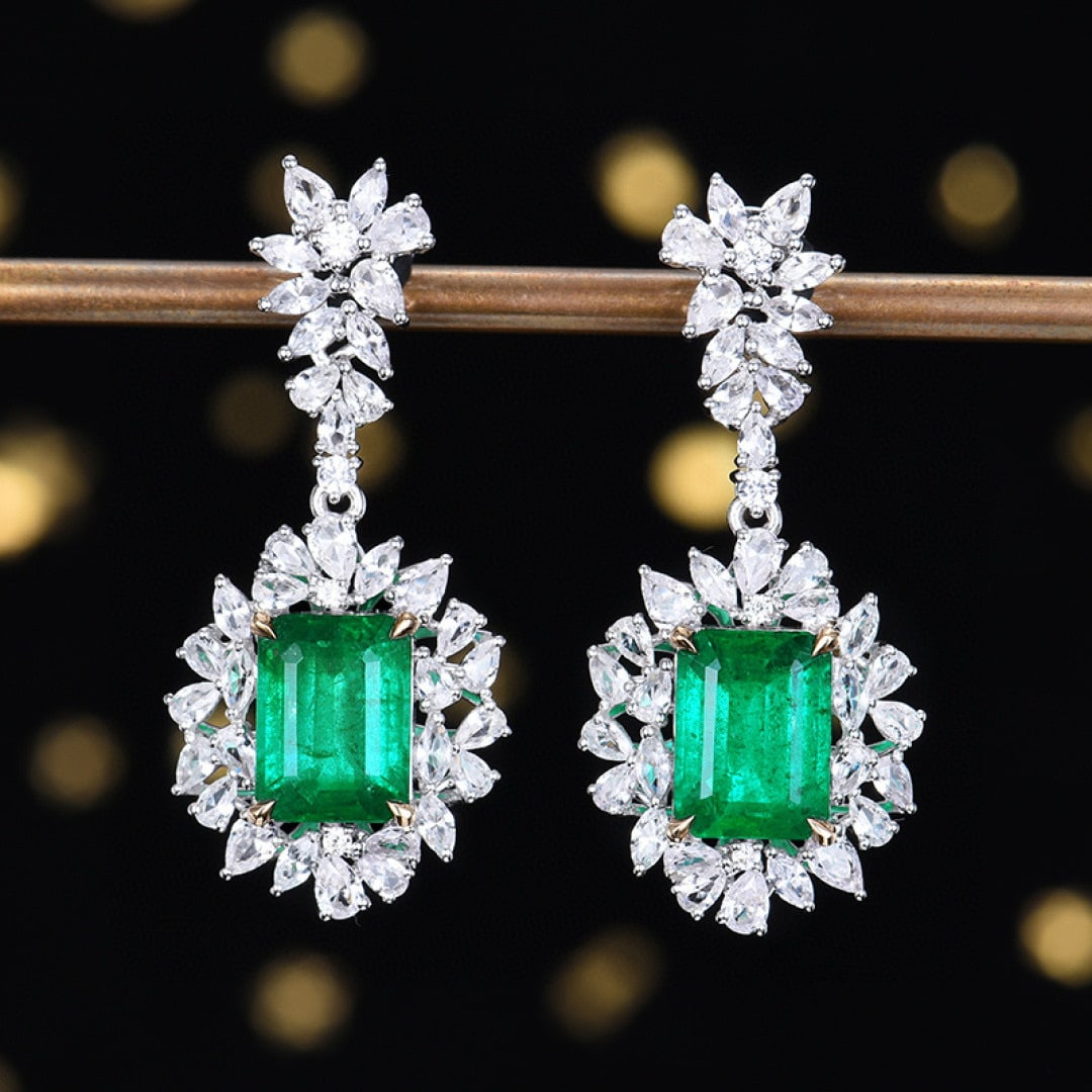 14k Gold 7.16 Ctw Vivid Green Natural Emerald & Sapphire Earrings: Ref:231090067 // gold content:14k gold // main gemstone:emerald // shape:octagonal // carat weight:4. 24ct // color:vivid green // treatment:natural // // adjacent gemstone 2 : sapphire // number