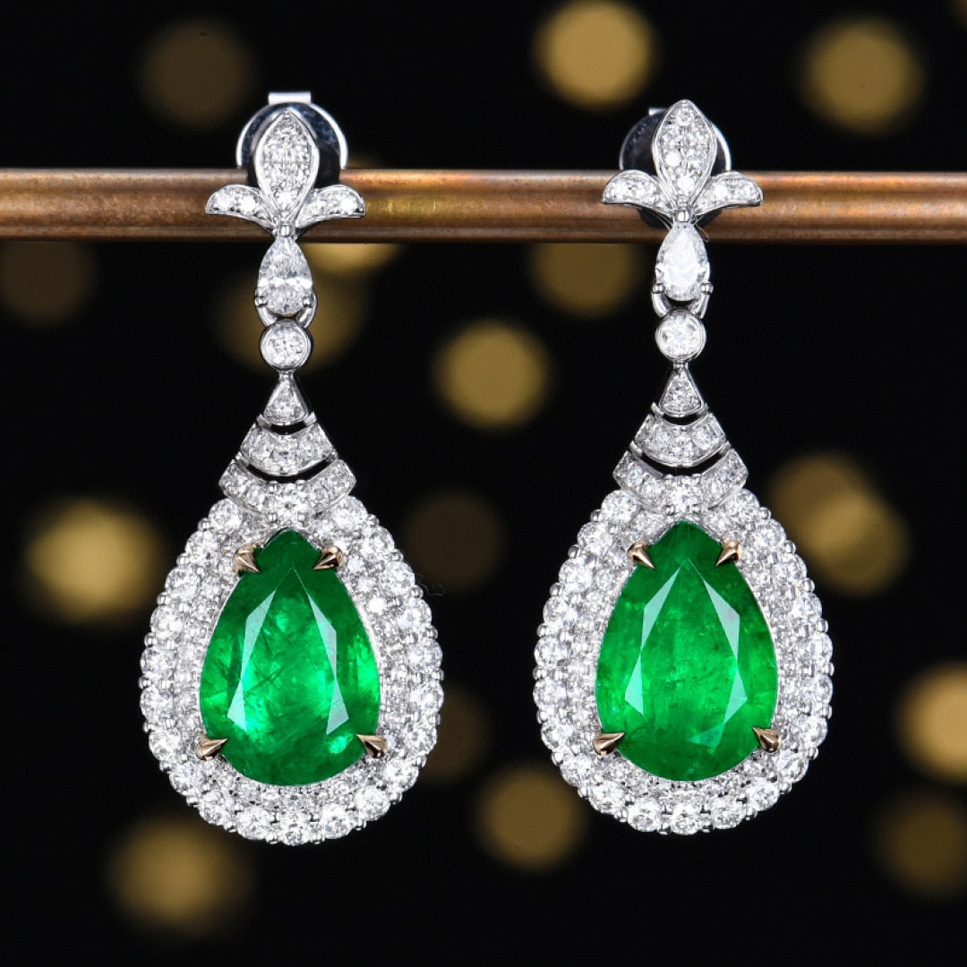 14k Gold 4.72 Ctw Vivid Green Natural Emerald & Diamond Earrings: Ref:231090071 // gold content:14k gold // main gemstone:emerald // shape:pear // carat weight:3. 59ct // color:vivid green // treatment:natural // // adjacent gemstone 2 : diamond // number of stones: