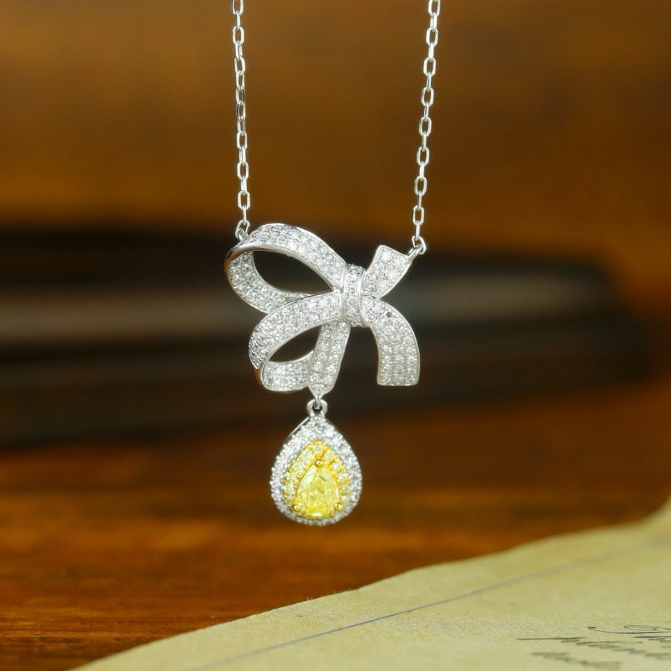 14k Gold 0.69 Ctw Natural Yellow Diamond & Diamond Necklace: Ref:231090118 // gold content:14k gold // main gemstone:yellow diamond // shape:pear // carat weight:0. 21ct // color:yellow // treatment:natural // // adjacent gemstone 2 : diamond // shape:round
