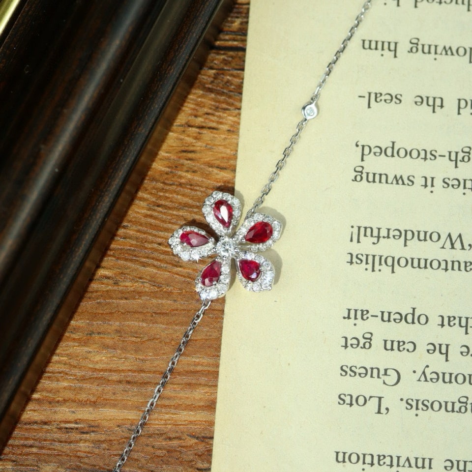 14k Gold 1.38 Ctw Natural Ruby & Diamond & Flowers Bracelet: Ref:231090119 // gold content:14k gold // main gemstone:ruby // shape:pear // carat weight:0. 90ct // color:red // treatment:natural // // adjacent gemstone 2 : diamond // shape:round // carat