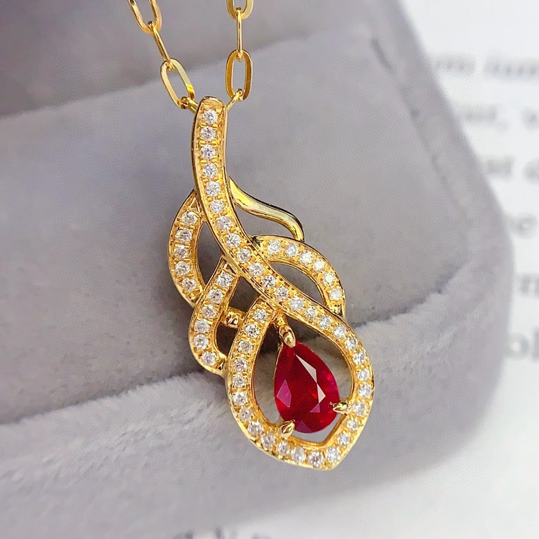14k Gold 0.7 Ct Vivid Red Natural Ruby & Diamond Necklace: Ref:231090346 // gold content:14k gold // main gemstone:ruby // shape:pear // carat weight:0. 7ct // color:vivid red // treatment:natural // // adjacent gemstone 2 : diamond // number of stones:53