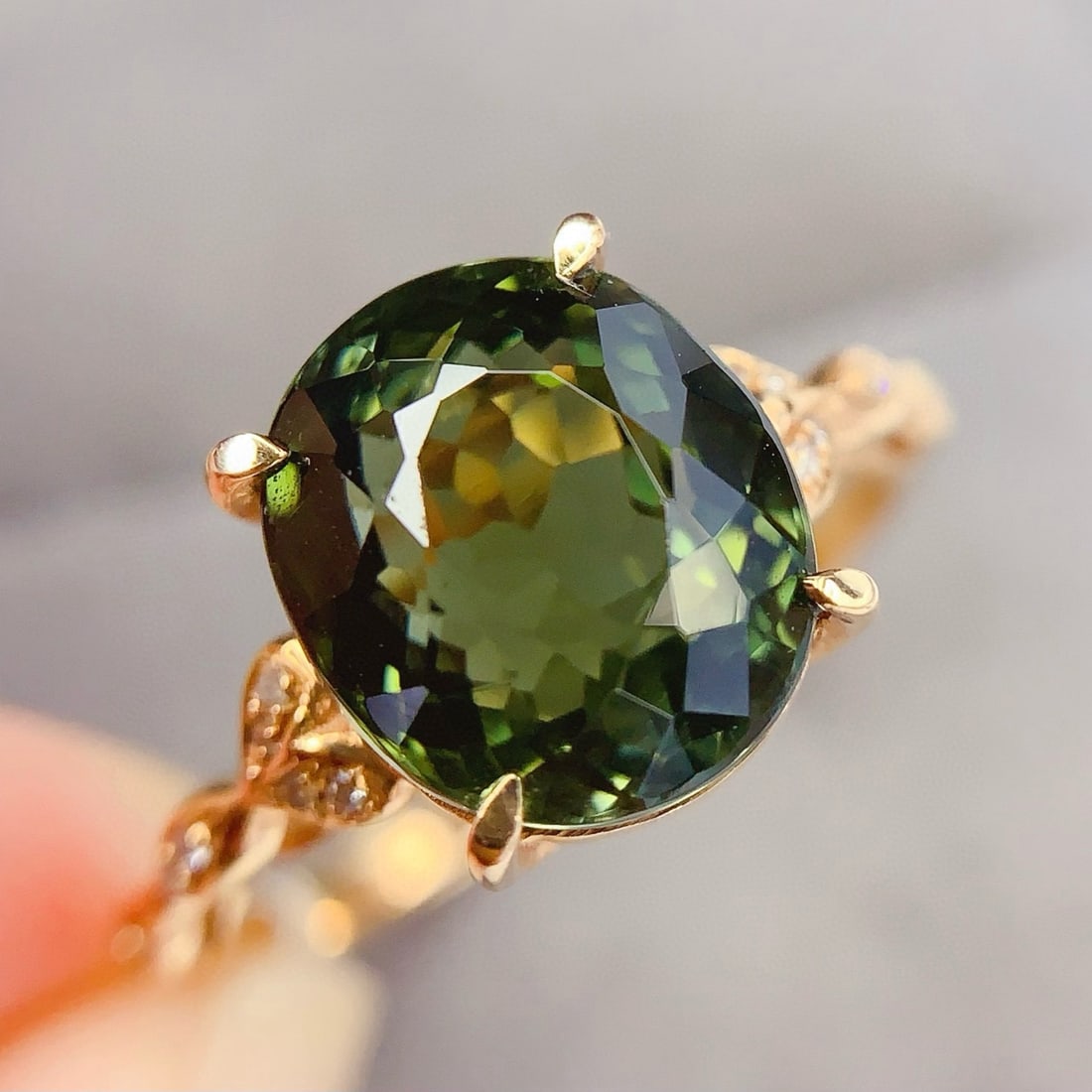14k Gold 4.2 Ct Natural Tourmaline & Diamond Ring: Ref:231090410 // gold content:14k gold // ring size:7. 25us // // main gemstone:tourmaline // shape:oval // carat weight:4. 2ct // color:green // treatment:natural // // adjacent gemstone 2 : diamond