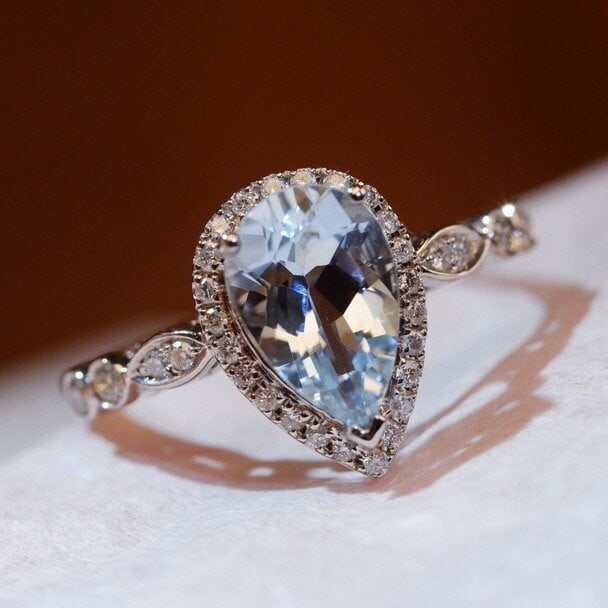 14k Gold 1.17 Ctw Natural Aquamarine & Diamond Ring: Ref:230942336 // gold content:14k gold // ring size:7. 25us // // main gemstone:aquamarine // shape:pear // carat weight:1ct // color:blue // treatment:natural // // adjacent gemstone 2 : diamond