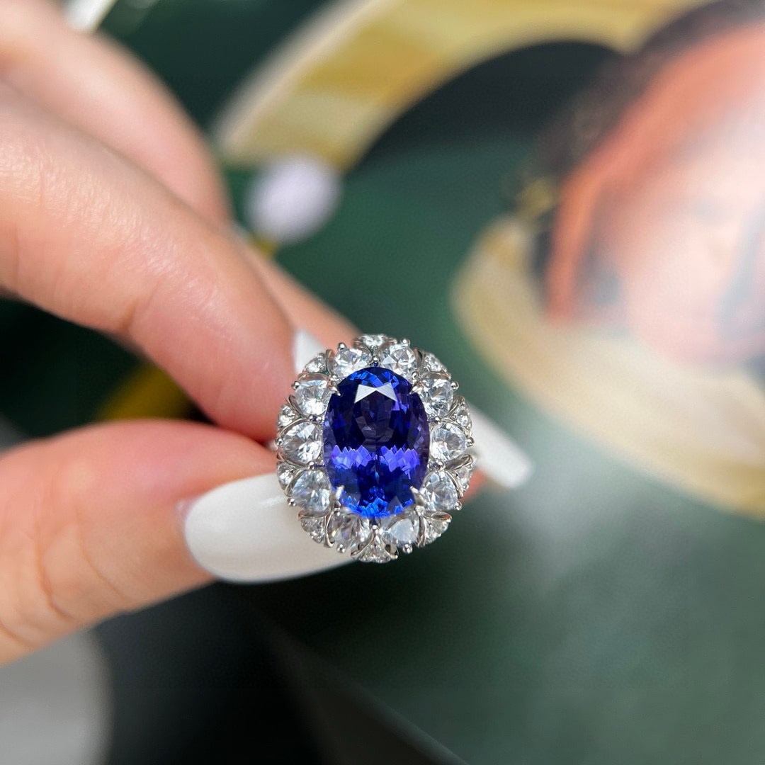 14k Gold 3.73 Ct Natural Tanzanite & Diamond & Sapphire Ring: Ref:230944044 // gold content:14k gold // ring size:7. 25us // // main gemstone:tanzanite // shape:oval // carat weight:3. 73ct // color:blue // treatment:natural // // adjacent gemstone 2 :