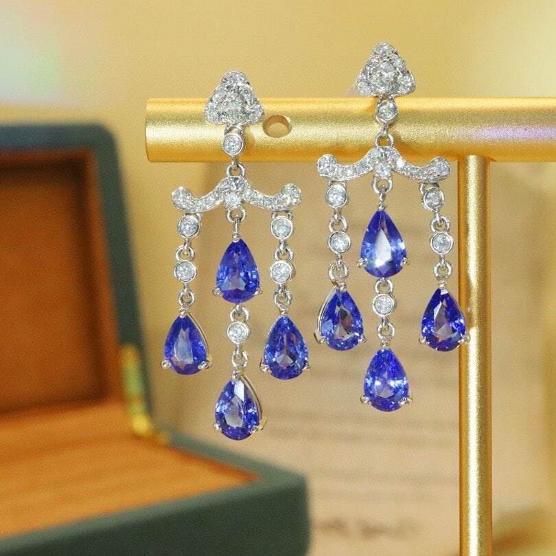 14k Gold 4.47 Ctw Natural Sapphire & Diamond Earrings: Ref:230944088 // gold content:14k gold // main gemstone:sapphire // shape:pear // carat weight:4. 16ct // color:cornflower blue // treatment:natural // // adjacent gemstone 2 : diamond // number of st