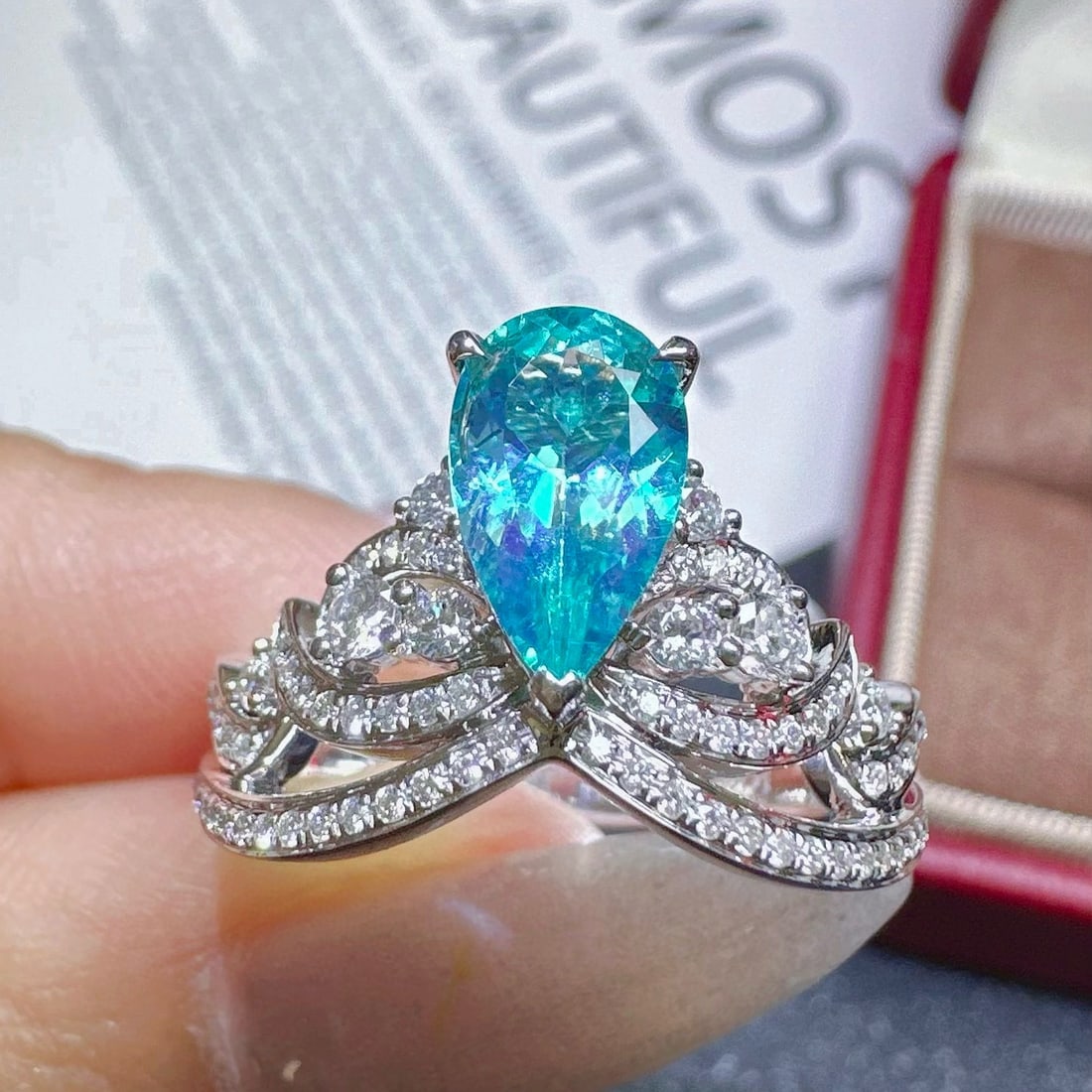 14k Gold 1.30 Ctw Natural Paraiba Tourmaline & Diamond Ring: Ref:230944106 // gold content:14k gold // ring size:7. 25us // // main gemstone:paraiba tourmaline // shape:pear // carat weight:0. 86ct // color:blue // treatment:natural // // adjacent gemstone 2 :