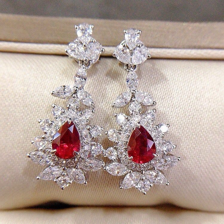 14k Gold 2.53 Ctw Natural Ruby & Diamond Earrings: Ref:230944147 // gold content:14k gold // main gemstone:ruby // shape:pear // carat weight:0. 96ct // color:pigeonblood red // treatment:natural // // adjacent gemstone 2 : diamond // shape:multiply /