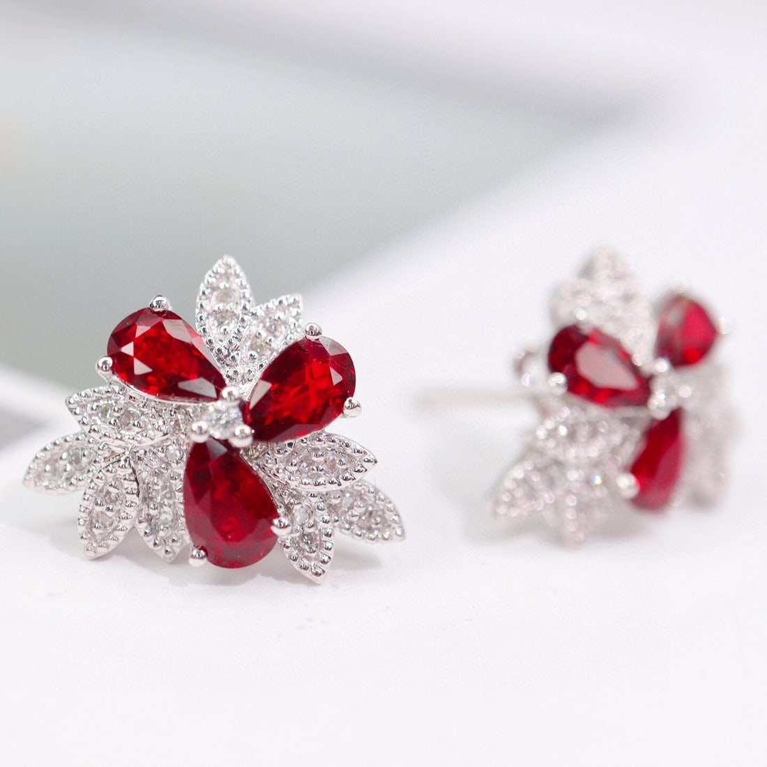 14k Gold 1.79 Ctw Natural Ruby & Diamond Earrings: Ref:230944447 // gold content:14k gold // main gemstone:ruby // shape:pear // carat weight:1. 65ct // color:pigeonblood red // treatment:natural // // adjacent gemstone 2 : diamond // shape:round // c