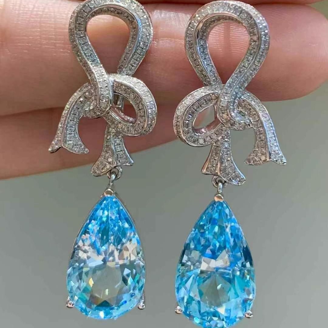 14k Gold 11.65 Ct Natural Aquamarine & Diamond Earrings: Ref:230945009 // gold content:14k gold // main gemstone:aquamarine // shape:pear // carat weight:11. 65ct // color:santa maria color // treatment:natural // // adjacent gemstone 2 : diamond //