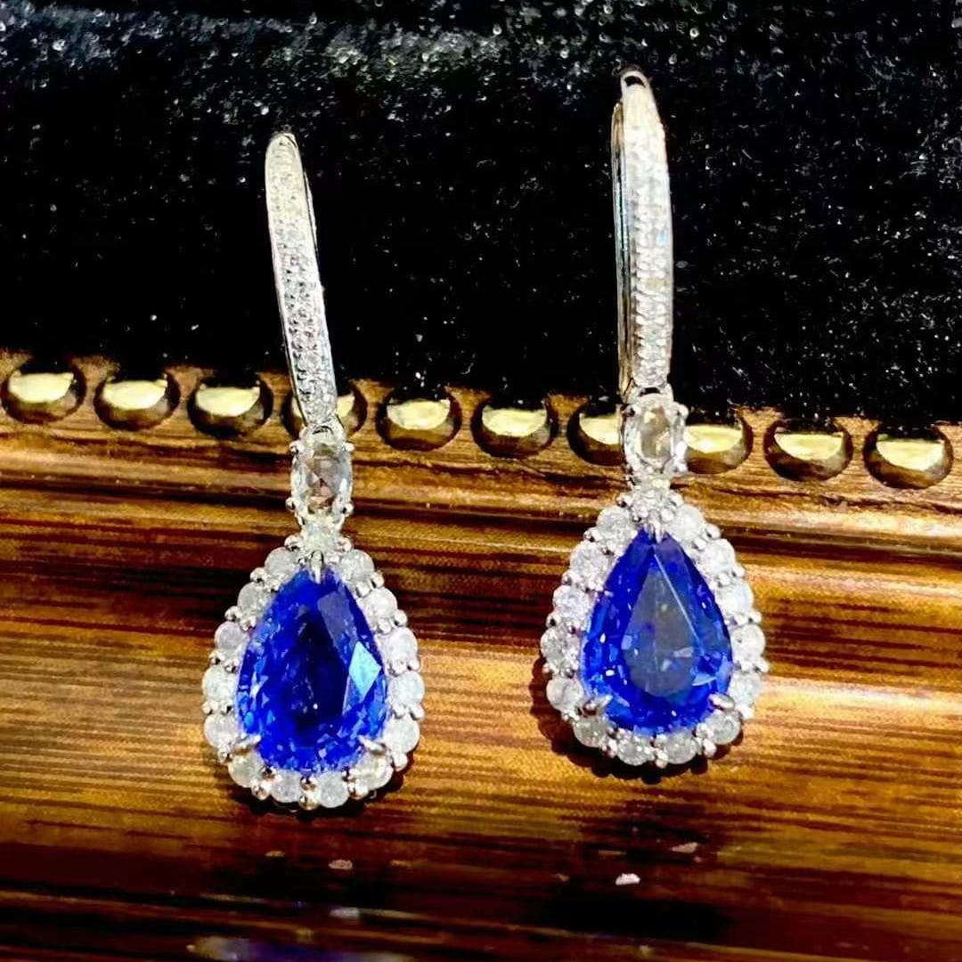 14k Gold 1.85 Ct Vivid Blue Natural Sapphire & Diamond & Sapphire Earrings: Ref:230945074 // gold content:14k gold // main gemstone:sapphire // shape:pear // carat weight:1. 85ct // color:vivid blue // treatment:natural // // adjacent gemstone 2 : diamond // shape:round //