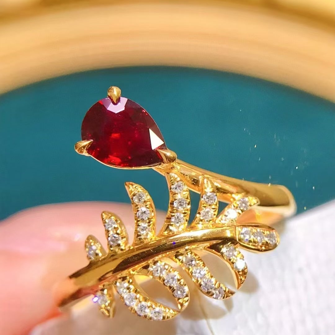 14k Gold 0.62 Ctw Natural Ruby & Diamond Ring: Ref:230945082 // gold content:14k gold // ring size:7. 25us // // main gemstone:ruby // shape:pear // carat weight:0. 5ct // color:pigeonblood red // treatment:natural // // adjacent gemstone 2 :