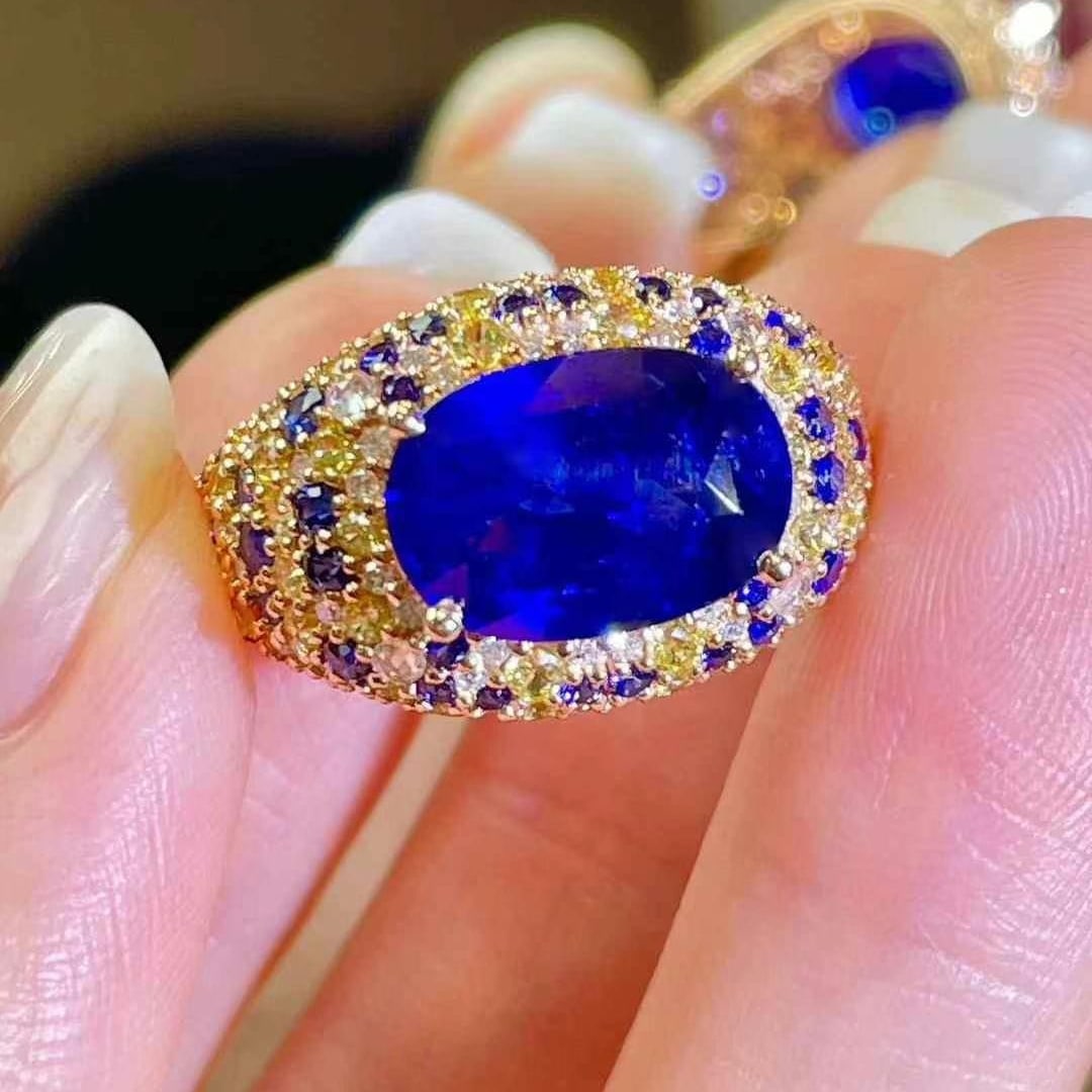 14k Gold 4 Ct Vivid Blue Natural Sapphire & Sapphire Ring: Ref:230945106 // gold content:14k gold // ring size:7. 25us // // main gemstone:sapphire // shape:oval // carat weight:4ct // color:vivid blue // treatment:natural // // adjacent gemstone 2 :