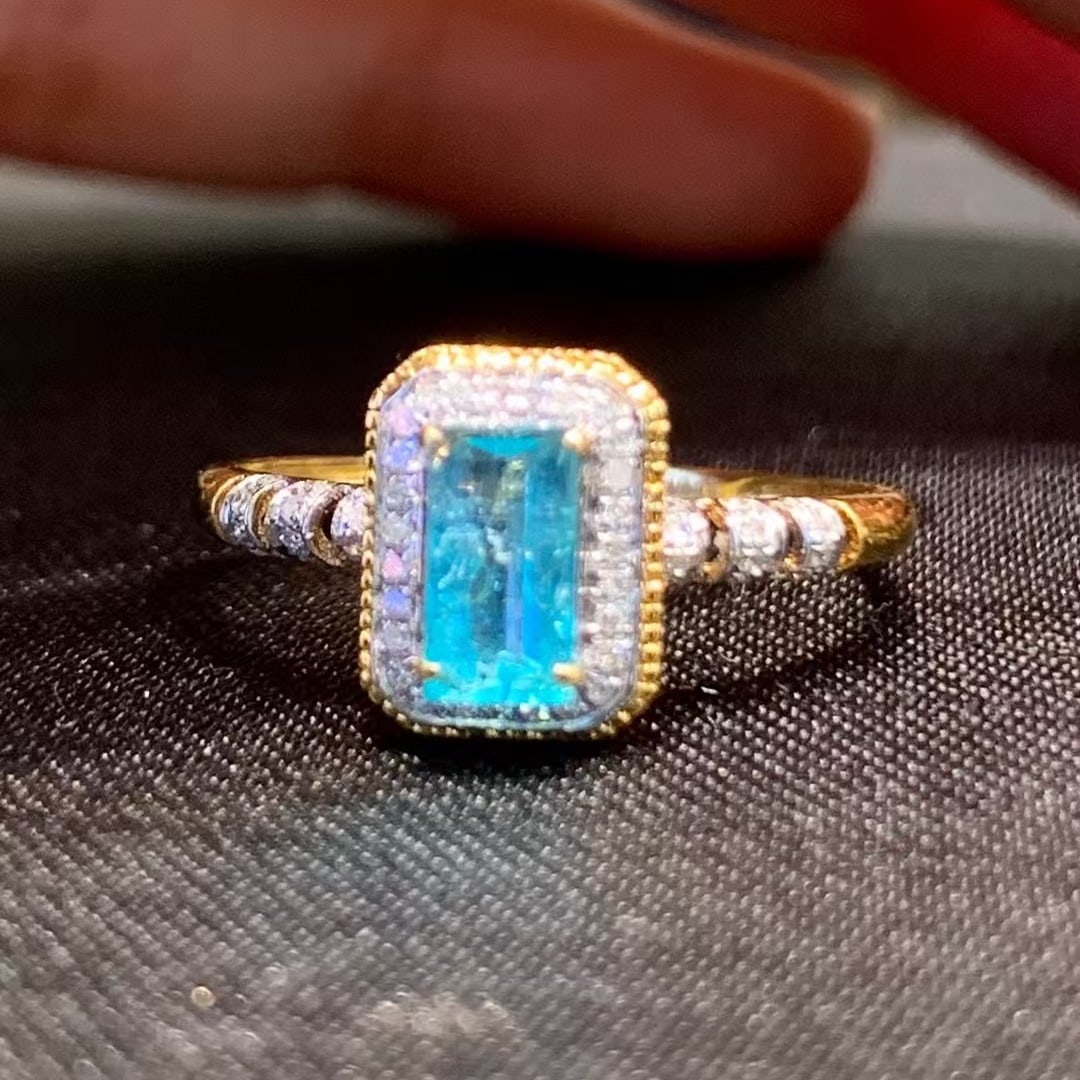 14k Gold 0.5 Ct Natural Paraiba Tourmaline & Diamond Ring: Ref:230945111 // gold content:14k gold // ring size:7. 25us // // main gemstone:paraiba tourmaline // shape:octagonal // carat weight:0. 5ct // color:blue // treatment:natural // // adjacent gemstone
