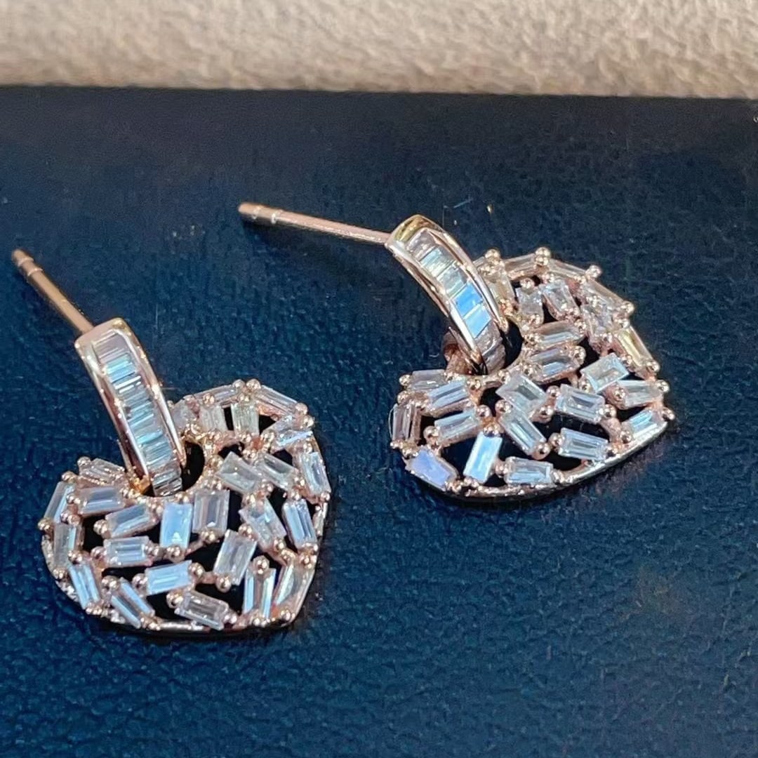 14k Gold 0.52 Ct Natural H Diamond Earrings: Ref:230945127 // gold content:14k gold // main gemstone:diamond // shape:baguette // carat weight:0. 52ct // clarity grade:vs-si // color:h // treatment:natural // Condition: NewLow Estimate:
