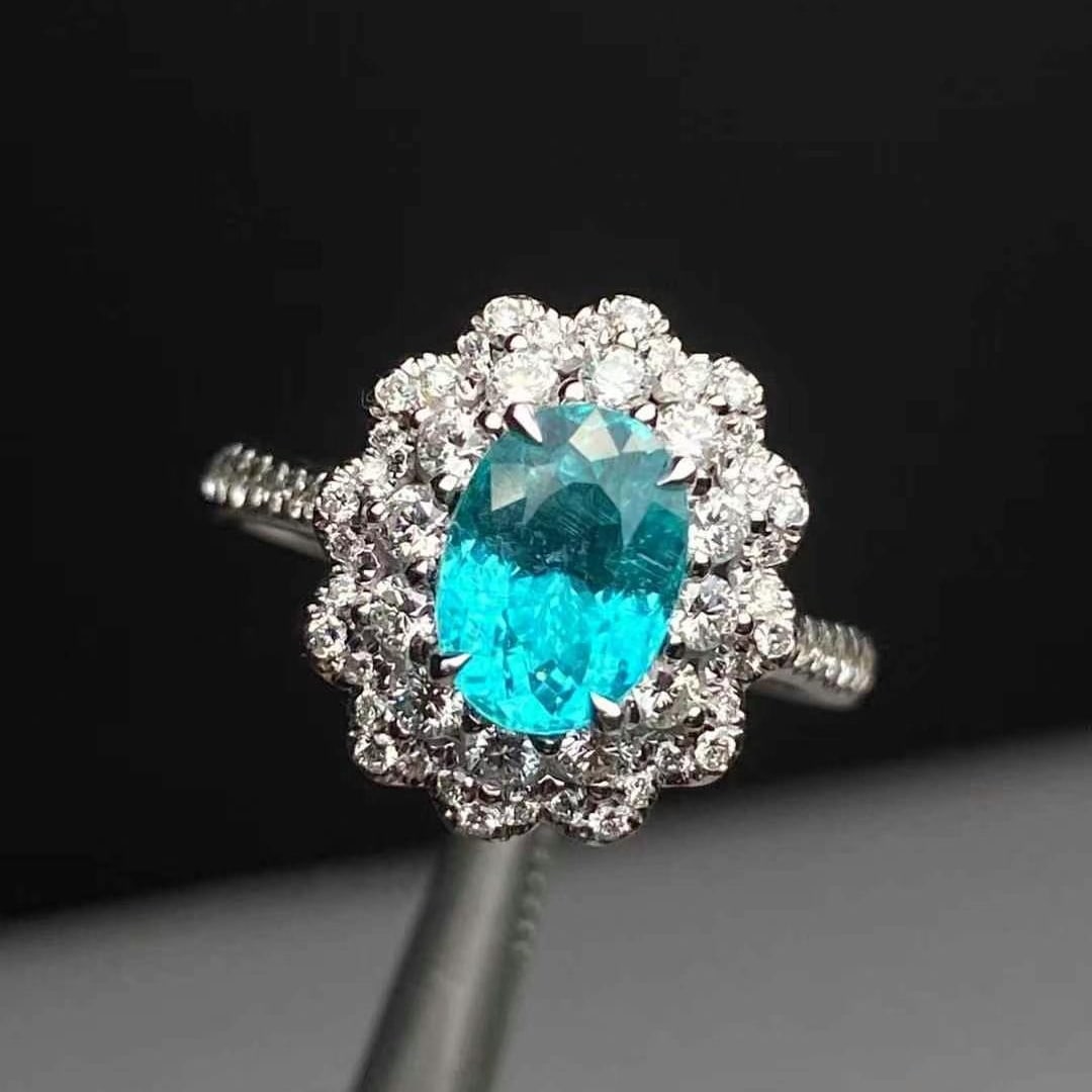 14k Gold 2.21 Ctw Natural Paraiba Tourmaline & Diamond Ring: Ref:230946011 // gold content:14k gold // ring size:7. 25us // // main gemstone:paraiba tourmaline // shape:oval // carat weight:1. 63ct // color:blue // treatment:natural // // adjacent gemstone 2 :