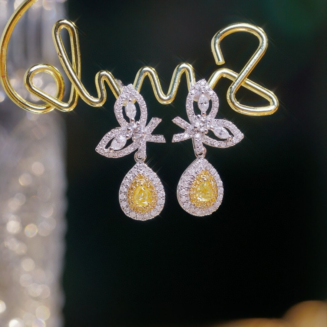 14k Gold 0.9 Ct Natural Color Diamond Earrings: Ref:230946020 // gold content:14k gold // main gemstone:diamond // shape:multiply // carat weight:0. 9ct // clarity grade:vs-si // color:color // treatment:natural // Condition: NewLow Estimate: