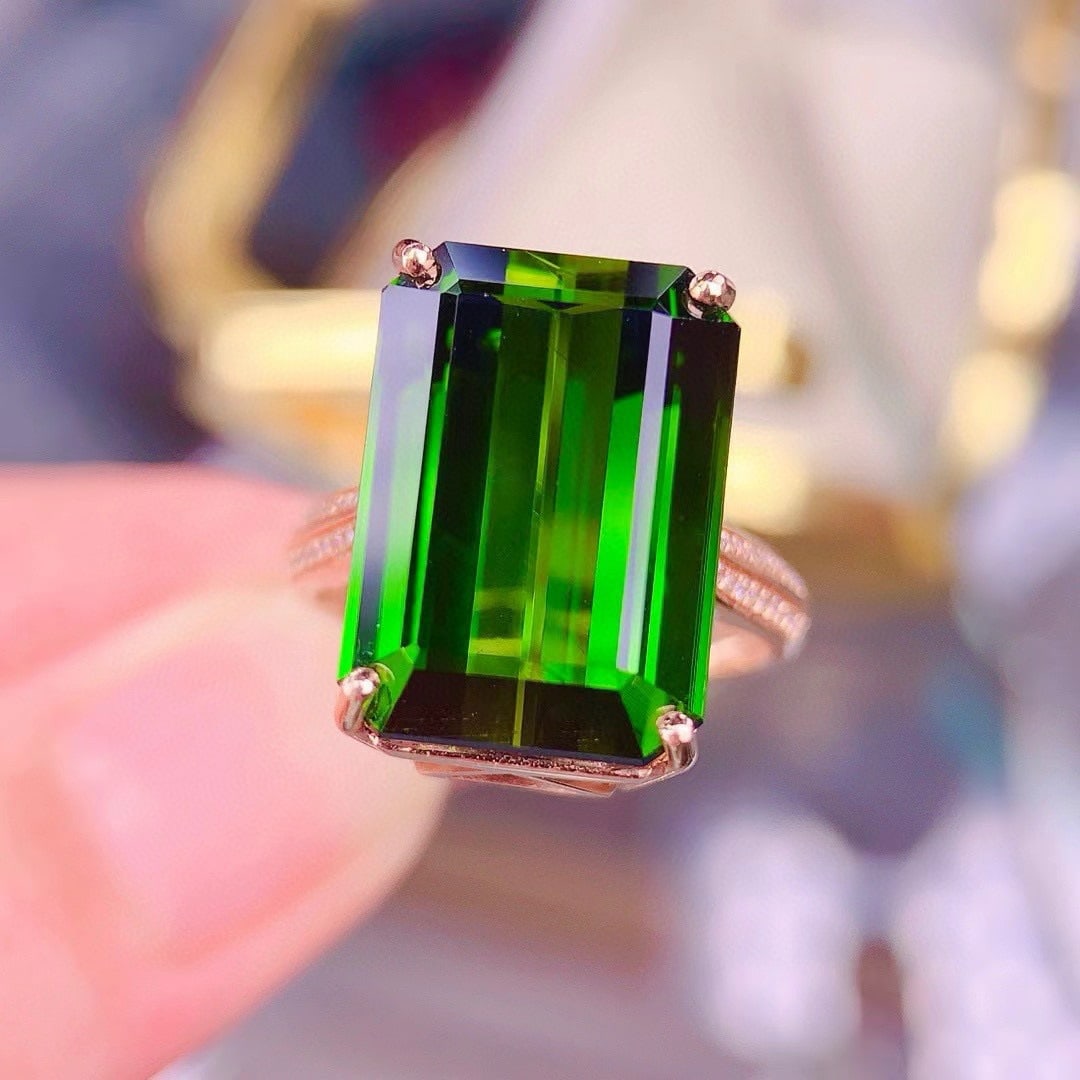 14k Gold 15.7 Ct Natural Tourmaline & Diamond Ring: Ref:230946100 // gold content:14k gold // ring size:7. 25us // // main gemstone:tourmaline // shape:octagonal // carat weight:15. 7ct // color:green // treatment:natural // // adjacent gemstone 2 : di