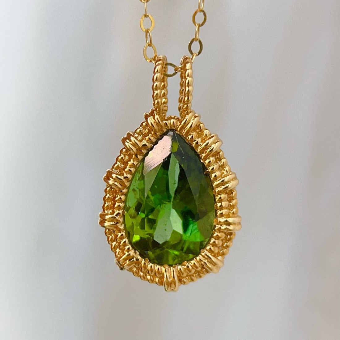14k Gold 2.19 Ct Natural Tourmaline Pendant( Without Chain ): Ref:230946185 // gold content:14k gold // main gemstone:tourmaline // shape:pear // carat weight:2. 19ct // color:green // treatment:natural // Condition: New Low Estimate: 3100.00 High Estimate: 460