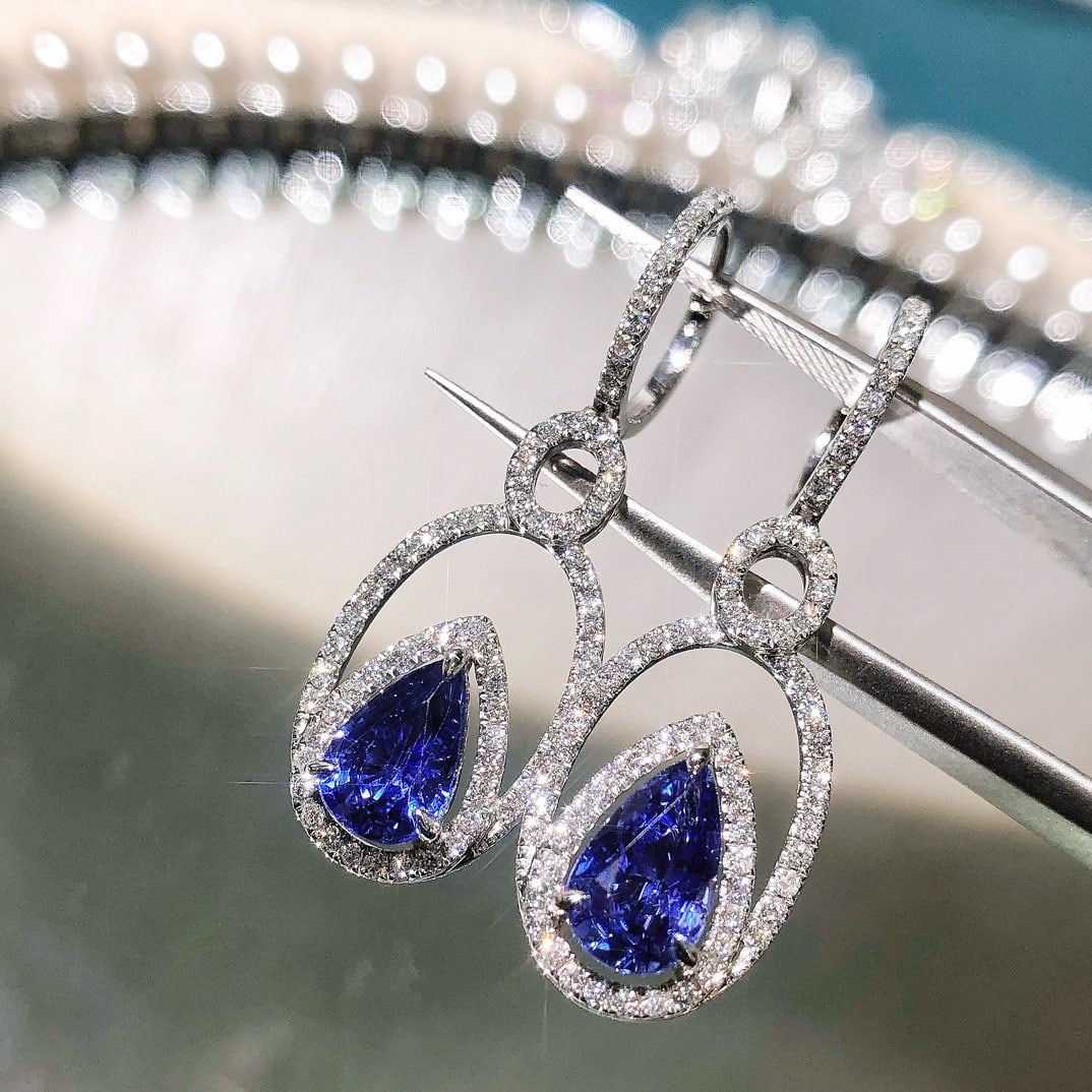 14k Gold 3.27 Ctw Natural Sapphire & Diamond Earrings: Ref:230946210 // gold content:14k gold // main gemstone:sapphire // shape:pear // carat weight:2. 56ct // color:royal blue // treatment:natural // // adjacent gemstone 2 : diamond // shape:round // ca