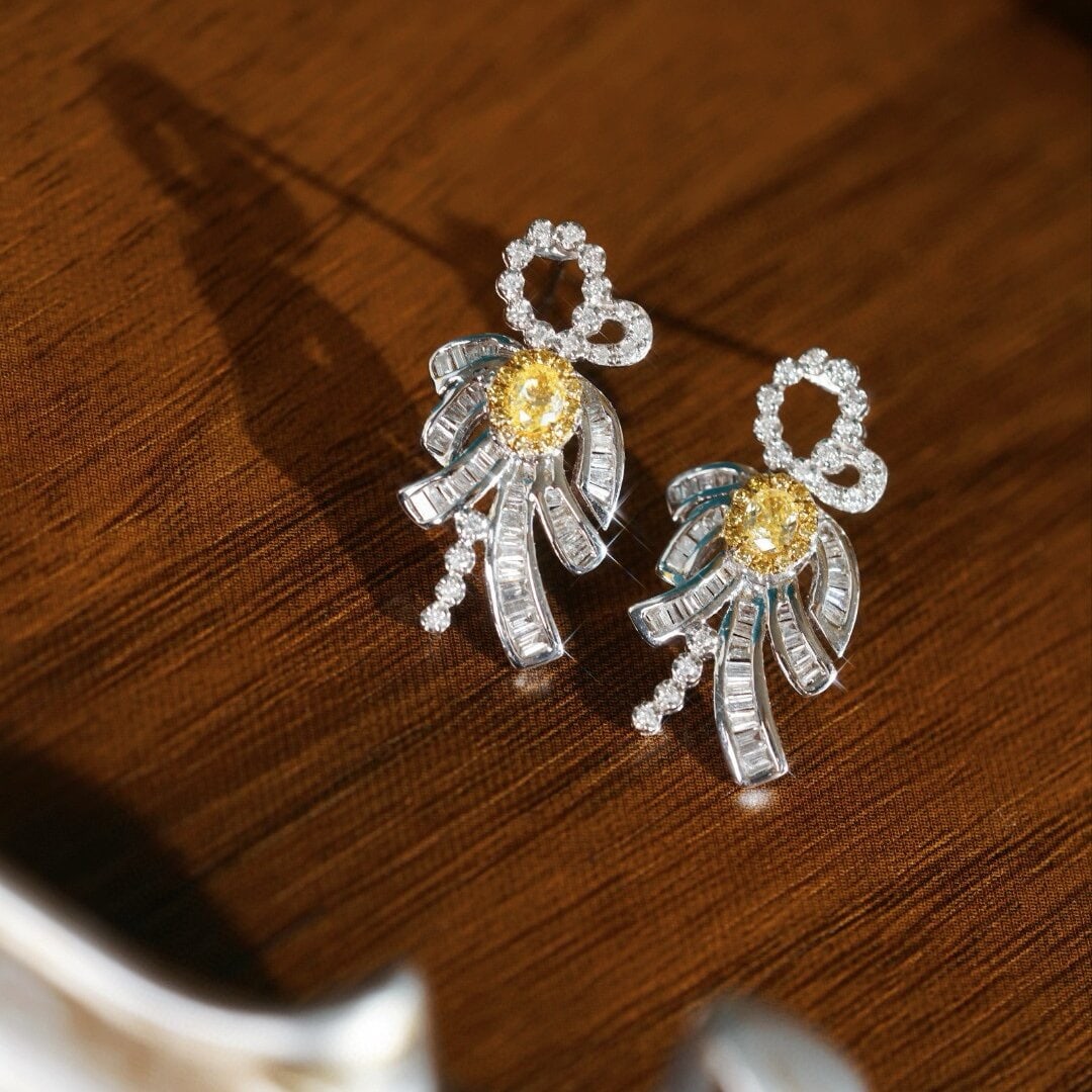 14k Gold 0.90 Ctw Natural Yellow Diamond & Diamond Earrings: Ref:230946419 // gold content:14k gold // main gemstone:yellow diamond // shape:oval // carat weight:0. 28ct // color:yellow // treatment:natural // // adjacent gemstone 2 : diamond //