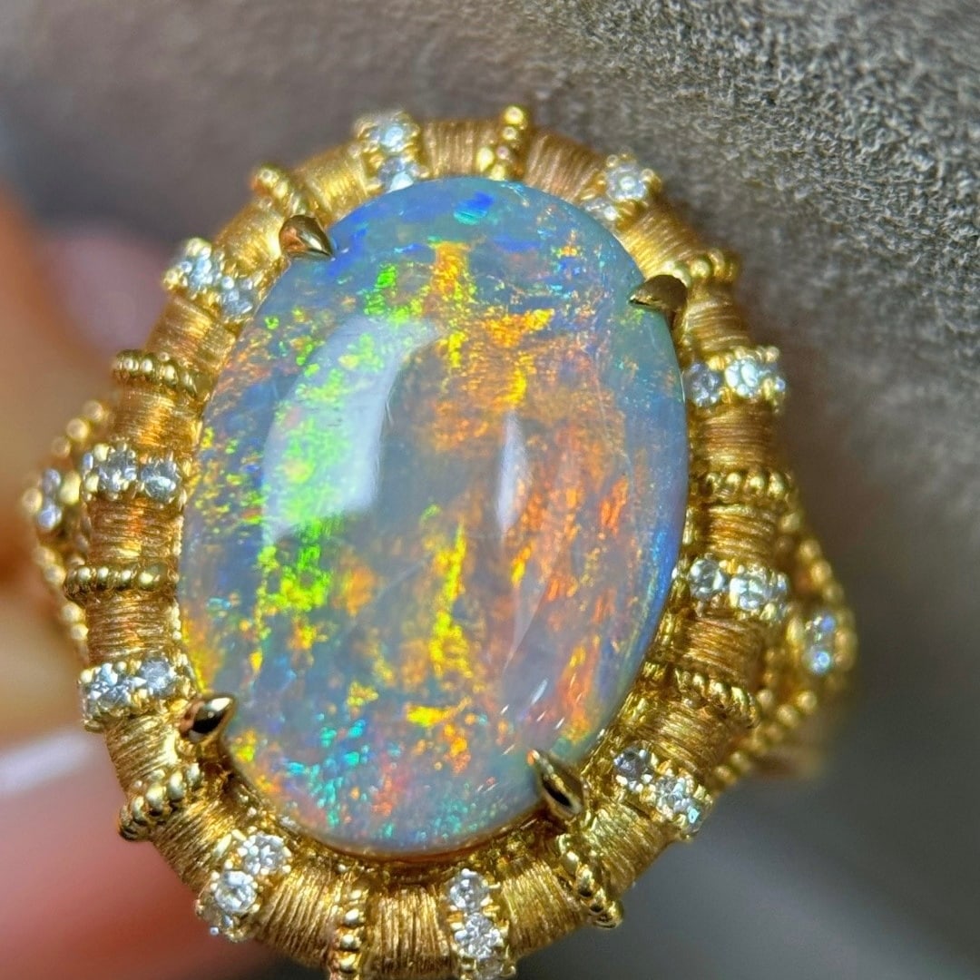14k Gold 5.24 Ctw Natural Opal & Diamond Ring: Ref:231173190 // gold content:14k gold // ring size:7. 25us // // main gemstone:opal // shape:oval // carat weight:5. 02ct // color:color // treatment:natural // // adjacent gemstone 2 : diamond // sh